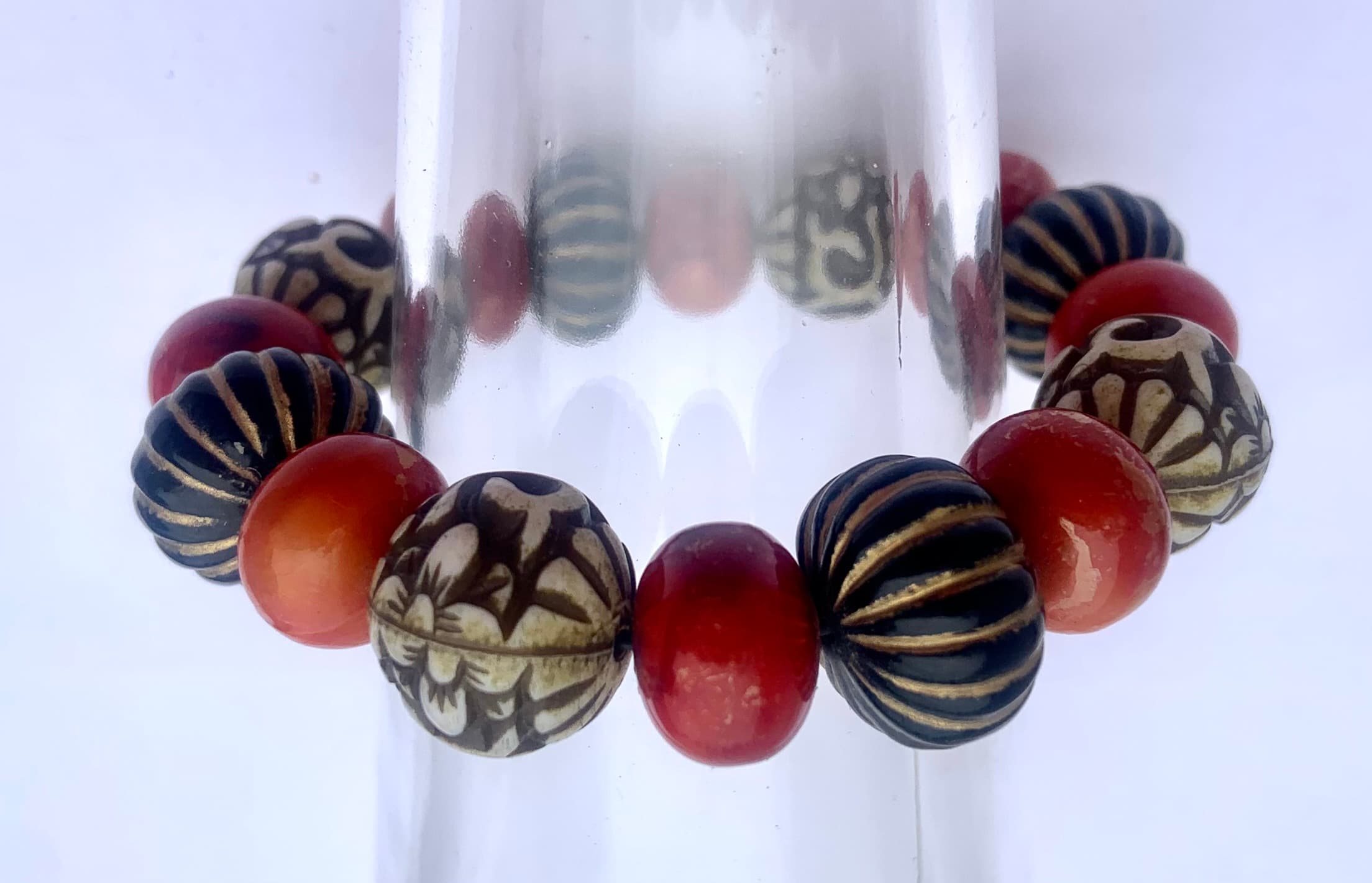 Bracelet with carved and red beads