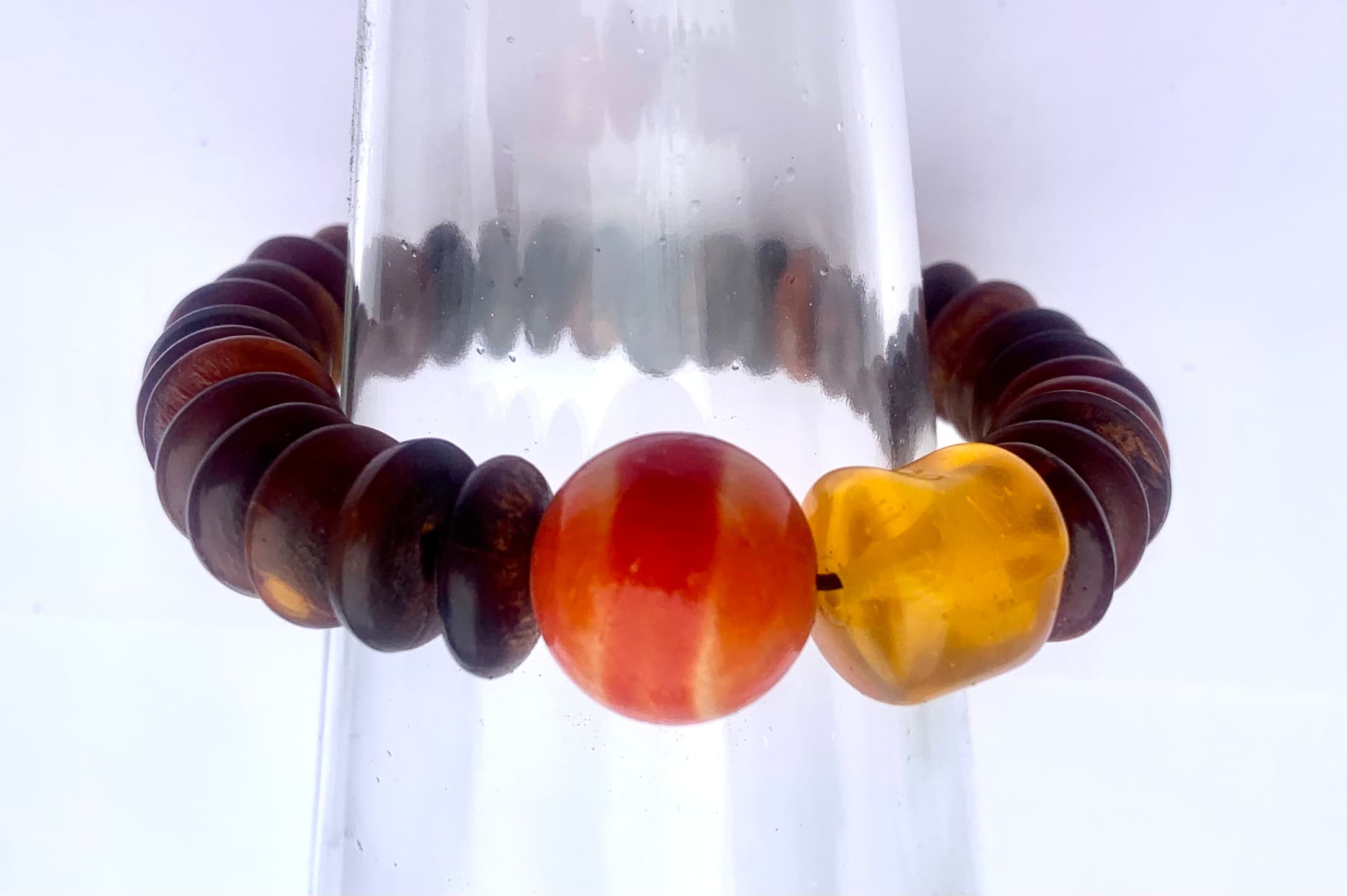 Tribal bracelet made with corneal matter and 2 amber tone bead