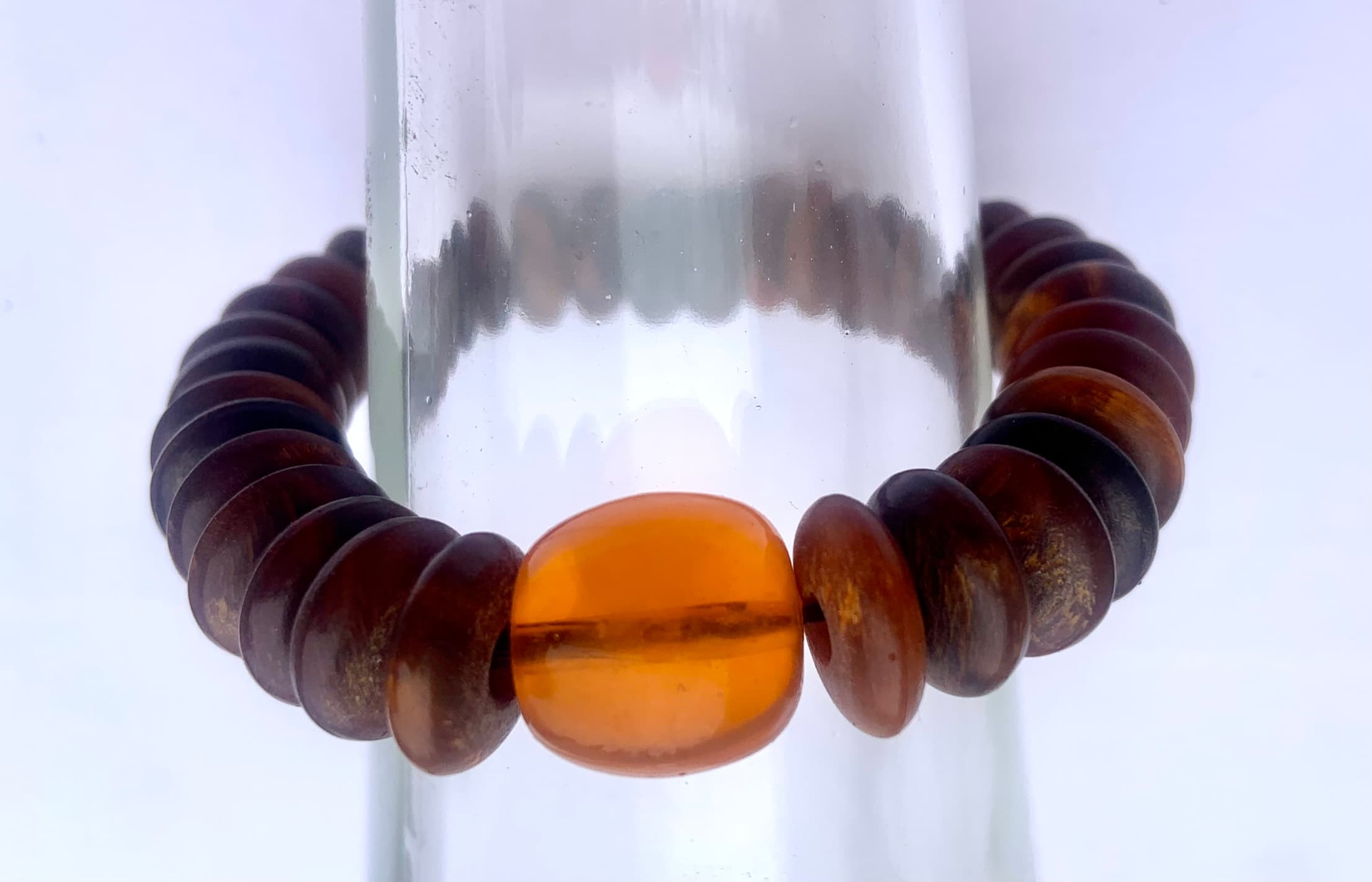 Tribal bracelet made with corneal matter and amber tone bead